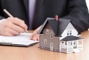 Real estate consultation with house model