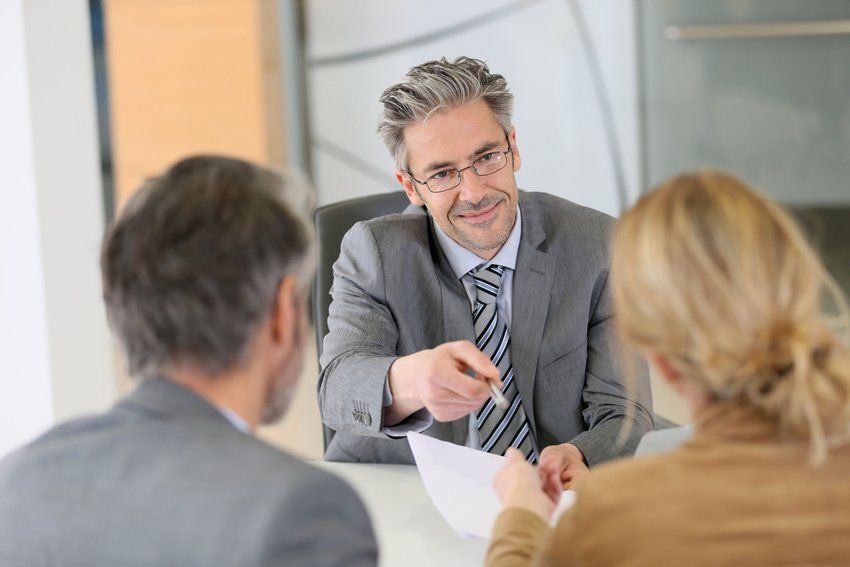 Attorney consulting with clients