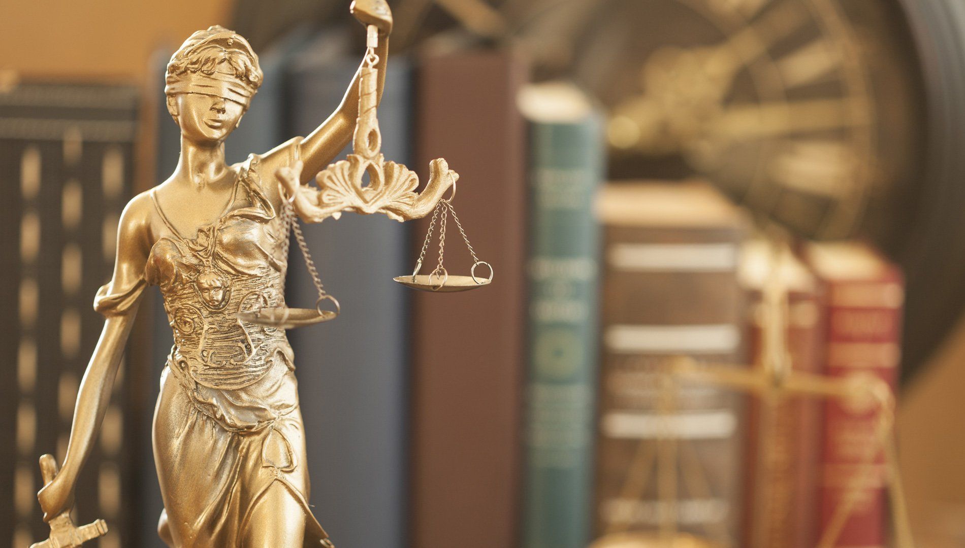 Lady Justice statue in a law library